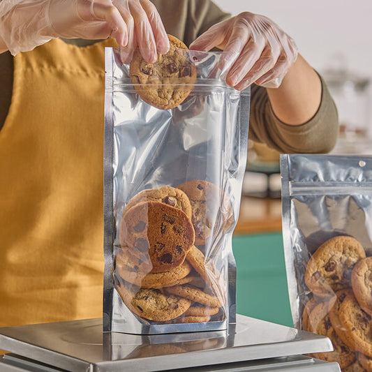 7 1/2" x 11 1/2" 3 Mil Silver Metallized / Clear Plastic Zip Top Stand-Up Pouch with Hanging Hole